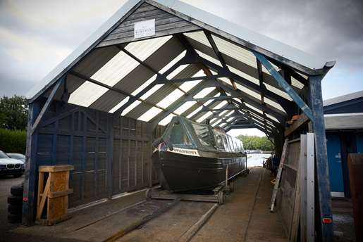 Boat on a trailer in the workshop at Cowroast